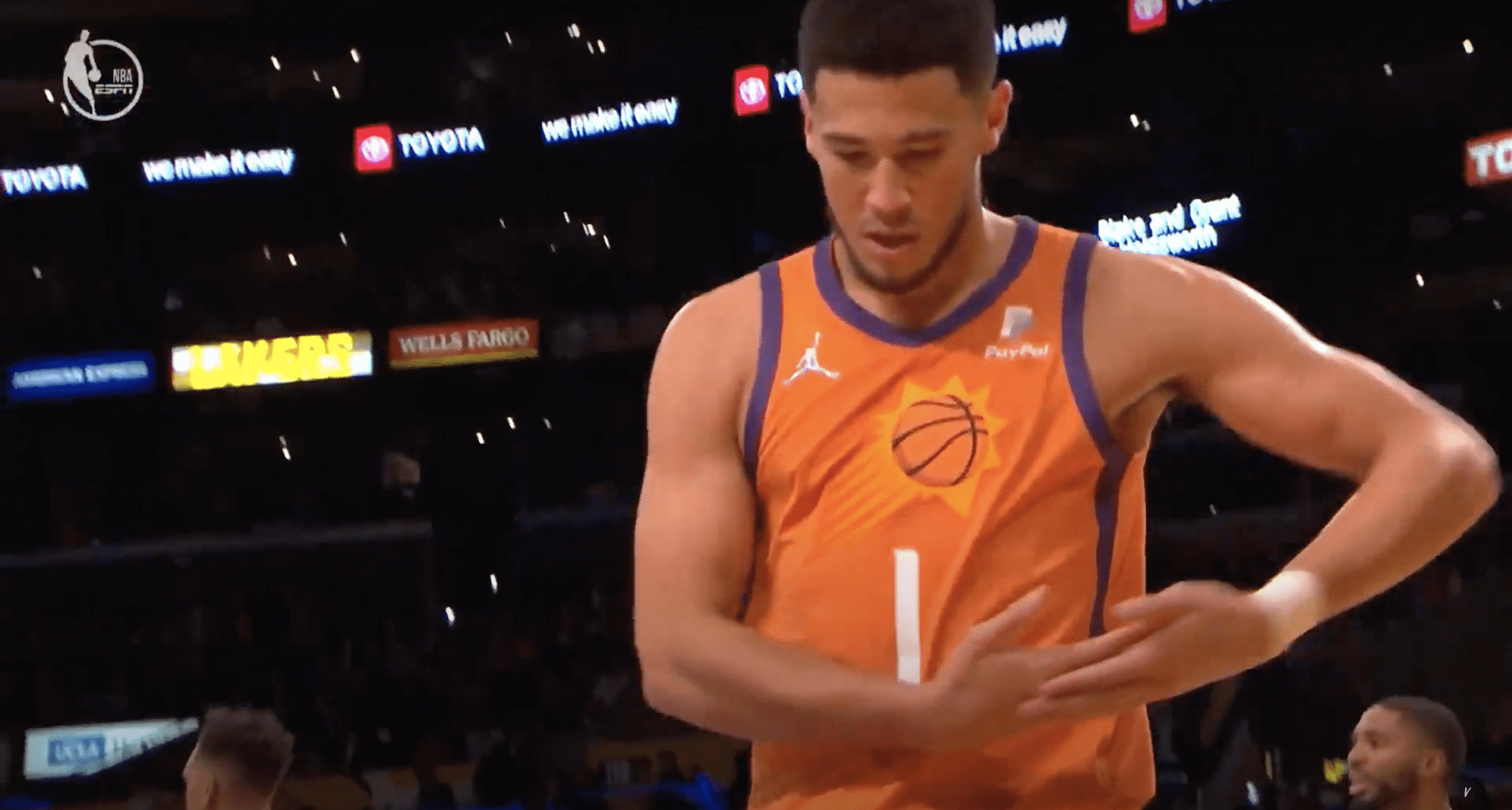 Devin Booker rocks the baby